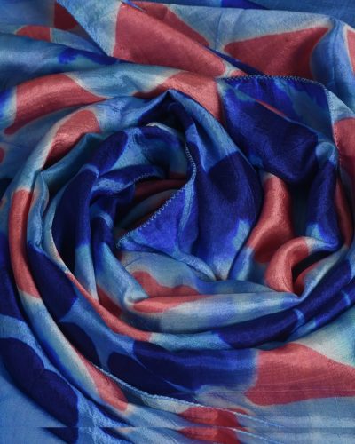 a blue, red, and white scarf with a design on it
