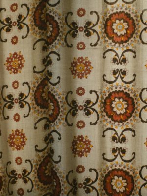 Cream fabric with brown and orange floral pattern